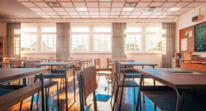 interior of a traditional school classroom with wooden floor and furniture. 3d render