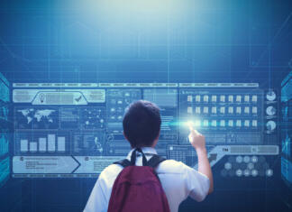 Razpis za krepitev digitalnih kompetenc pri mladih Male school boy student using virtual screen hologram