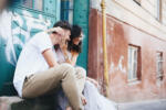 Beautiful,And,Young,Boy,And,Girl,Sits,Near,Green,Doors