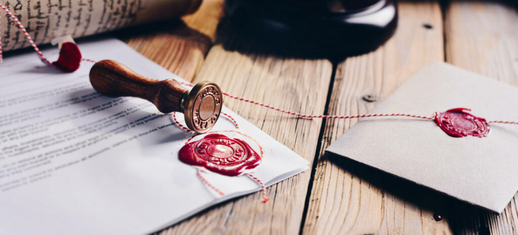 Notary public wax stamper and wax seal on document