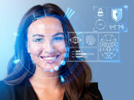 Smiling businesswoman in formal wear watching at digital interface with facial recognition by digital interface with line connection hologram. Concept of modern technology of artificial intelligence