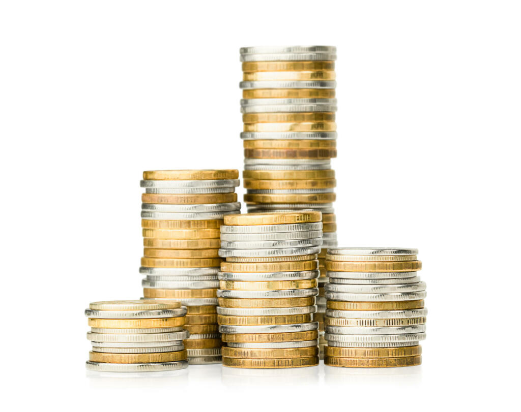 stacks of coins on a white isolated background