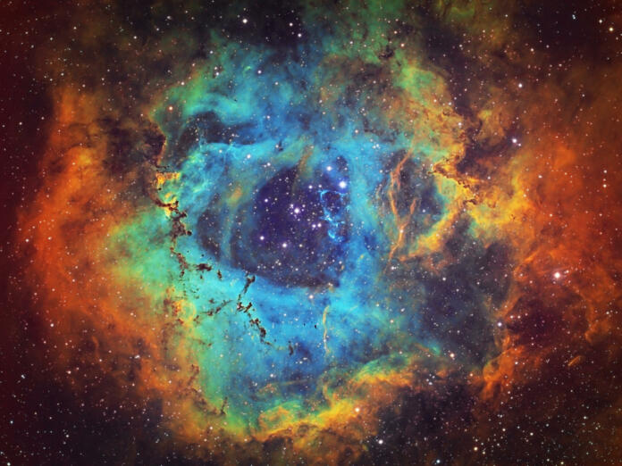 The Rosette Nebula (NGC 2237, Caldwell 49) is the large hydrogen, sulfur and oxygen gas cloud in the constellation of Monoceros. The open star cluster NGC 2244 (Caldwell 50) consists of stars being formed from the nebula. The nebula is 5,200 light years away from Earth. Amateur image, total exposure time: 15h45m, HST palette image.