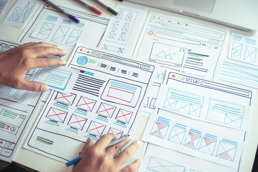 Website designer Creative planning application developer development draft sketch drawing template layout prototype framework wireframe design studio . User experience concept .