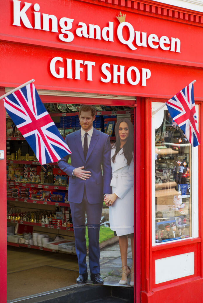 Windsor, UK - May 5, 2018: Souvenir shop in Windsor with prince Harry and Meghan Markle portraits after engagement.