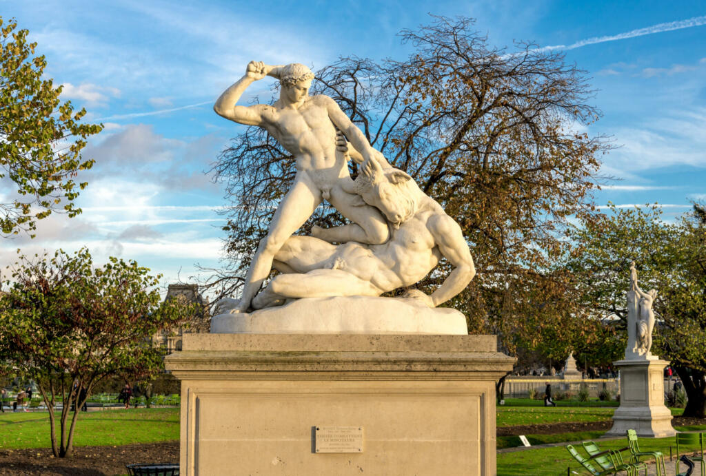An antique statue of Theseus fighting with Minotaur in the Tuileries garden, Paris, France, autumn season, November 2017Sculptures erected in 19th century