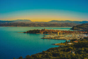 Beautiful view on Adriatic coast,Slovenia, Italy. Seaside,mountain and boat on image. Colorful image. Above area. Izola city.