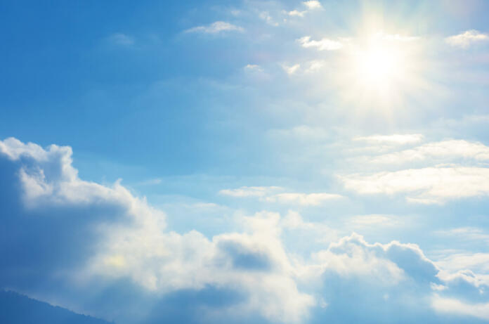 blue sky with sun and clouds. beautiful bright nature scenery