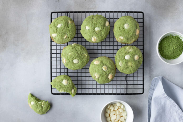 flat lay composition with green tea matcha cookies on cooling rack. Healthy trendy dessert. gray background. copy space