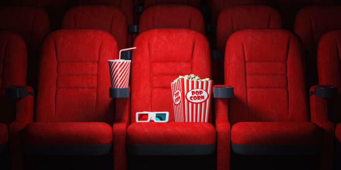 Red cinema seats and cola, popcorn and glasses in empty theater. Cinema movie theater concept background. 3d illustration
