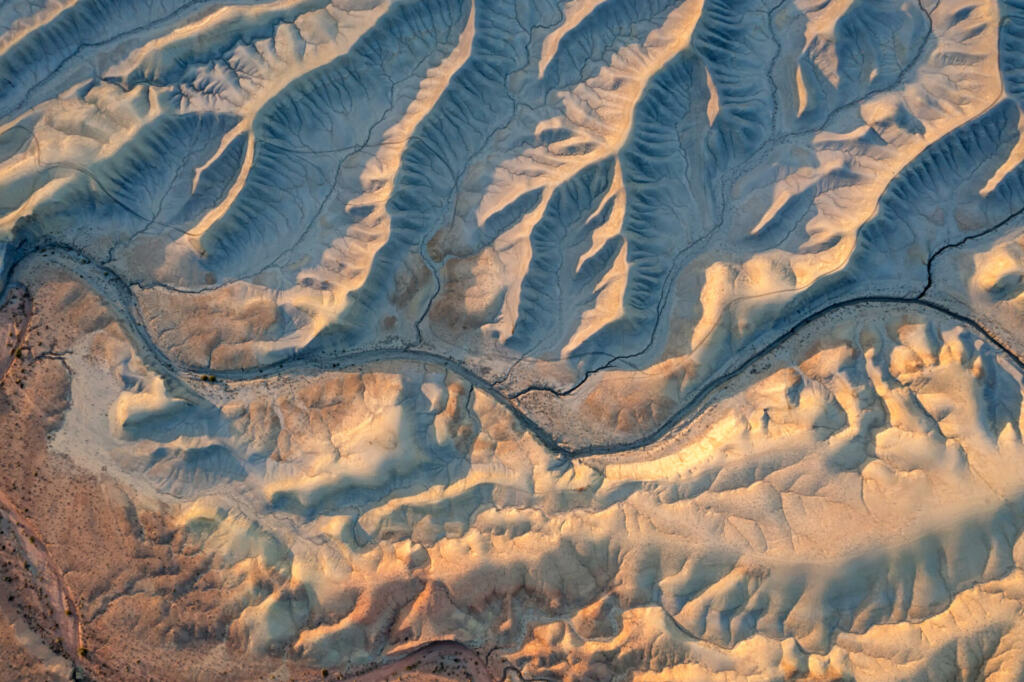 An aerial view of a mountain road surrounded by mountain with drone, Utah, United States of America.