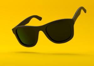 Black summer sunglasses falling down on a pastel bright yellow background. Side view. Creative minimal concept. 3d rendering illustration