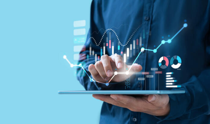 Businessman trading online stock market on teblet screen, digital investment concept