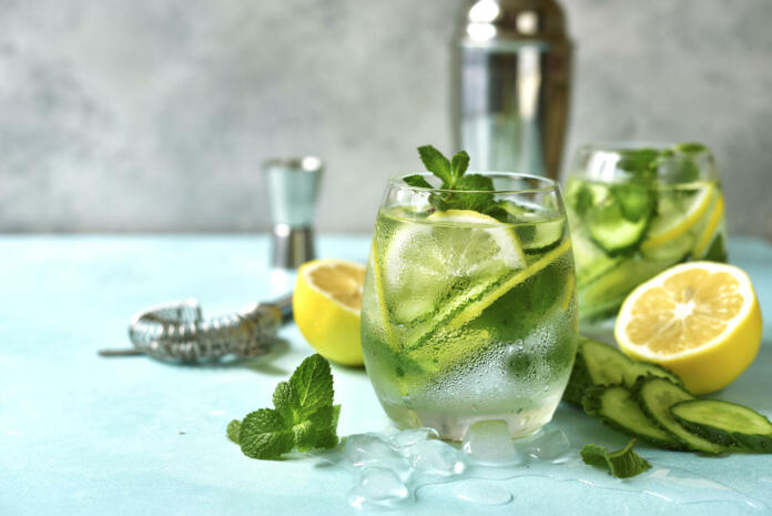 Cucumber and lemon refreshing drink with mint in a glasses.