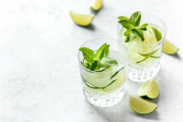 Cucumber and lime refreshing gin cocKtail, light alcohol drink concept, copy space for a text