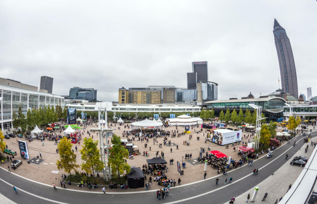 Frankfurt, Germany - October 12, 2014: public day for Frankfurt Book fair, visitors at the great place with reading tent in Frankfurt, Germany. The fair is open at the weekend for public.