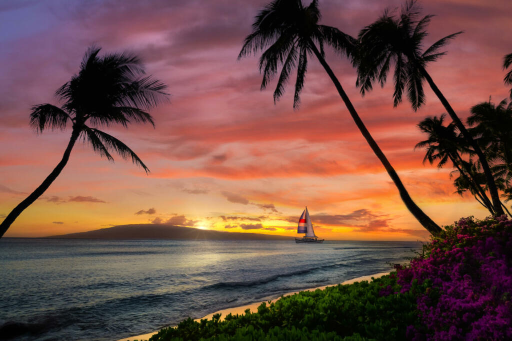 Hawaiian sunset with sailboat and mountains