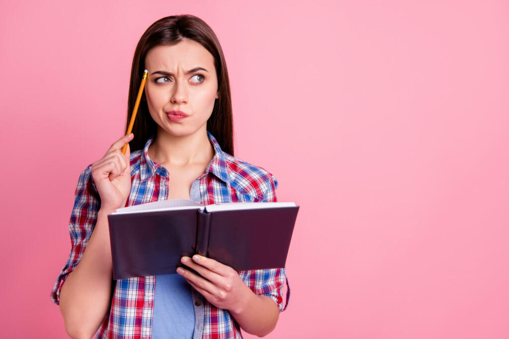 Portrait of focused attractive youth people person have thoughts try decide, choose solve problem trouble prepare lesson dressed plaid modern clothing shirt trendy stylish isolated pink background