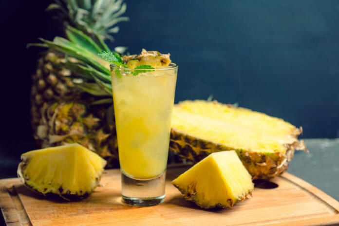 Sweet cocktail with pineapple and rum. Selective focus.