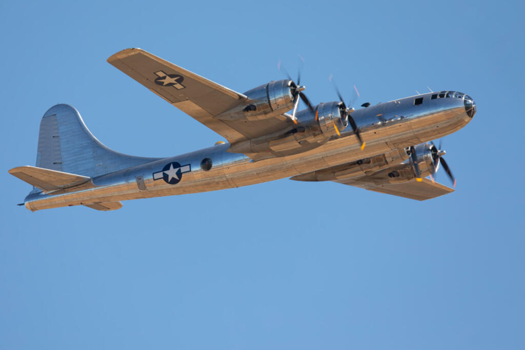 Very close side view of a rare WWII bomber (B-29 Superfortress) flying