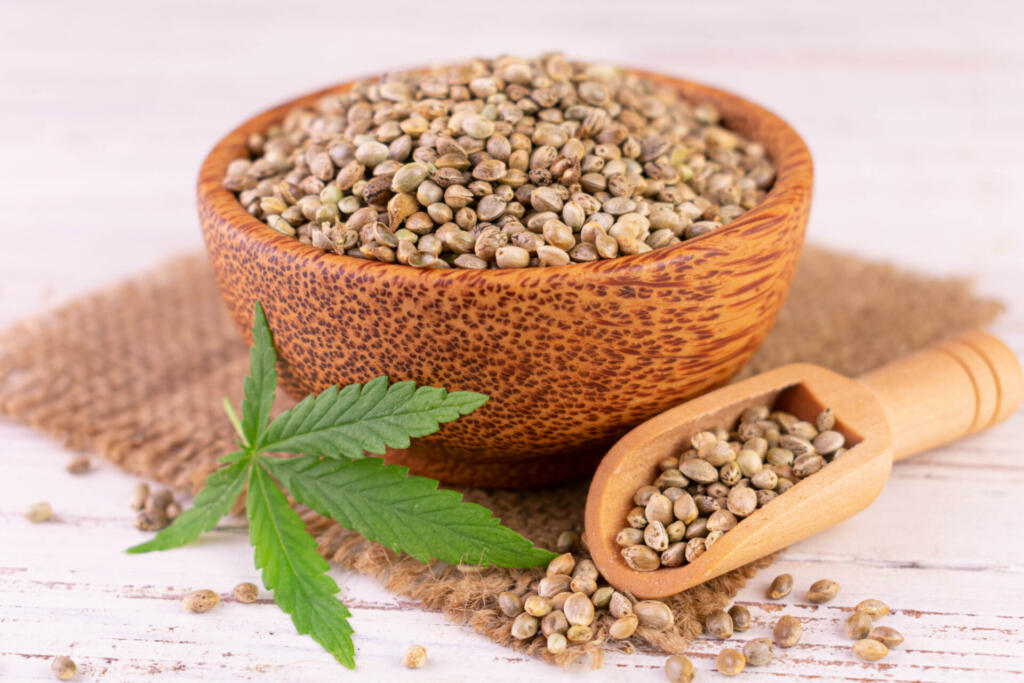 Hemp seeds in a wooden bowl. Close-up.