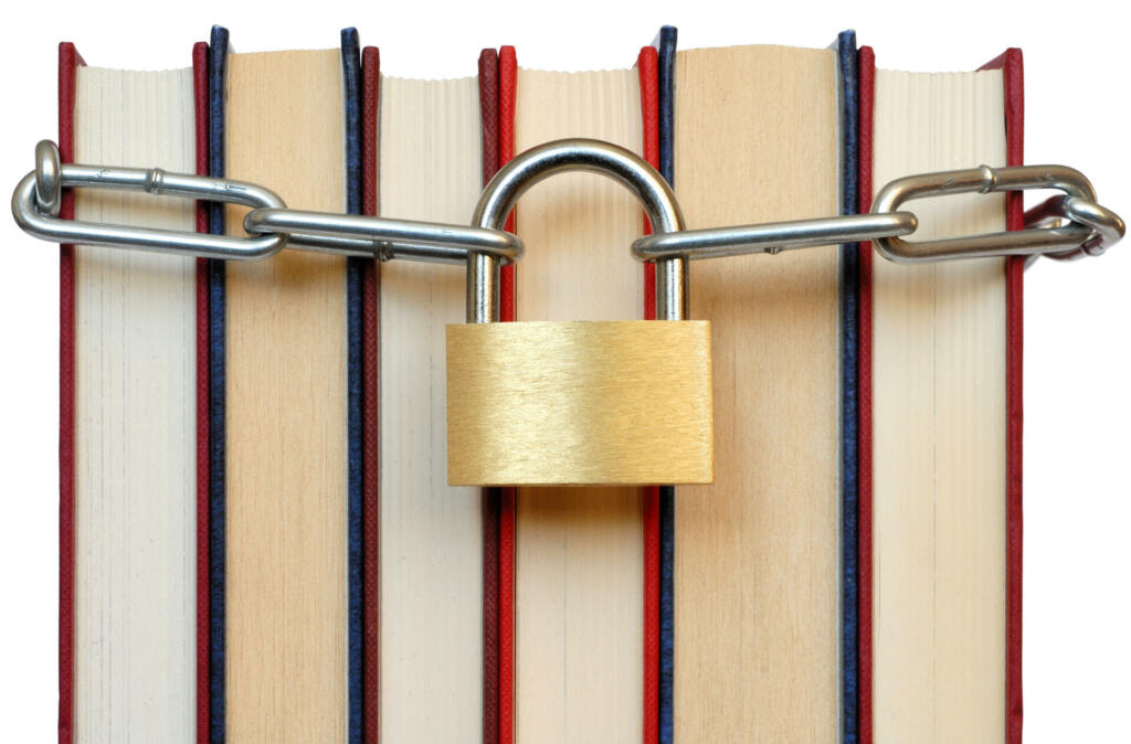 Isolated books and chain with padlock