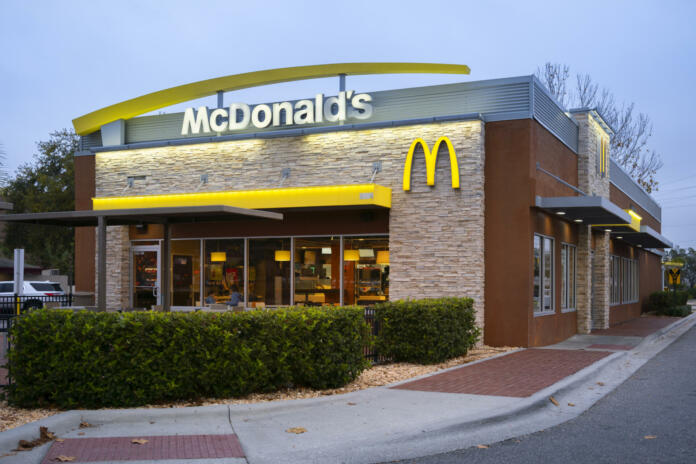 Kissimmee, Florida - February 6, 2022: Night Closeup View of McDonald's Restaurant Building Exterior.