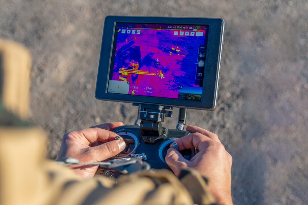 San Rafael, Argentina, June 12, 2021: firefighter flying drone with thermal camera