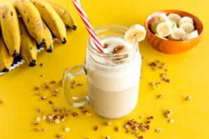 a banana smoothie cup, healthy shake of banana with milk