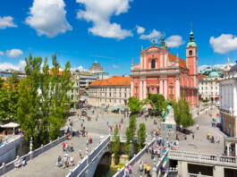Romantic Ljubljana city center. River Ljubljanica, Triple Bridge - Tromostovje, Preseren square and Franciscan Church of the Annunciation. Ljubljana Slovenia Europe.