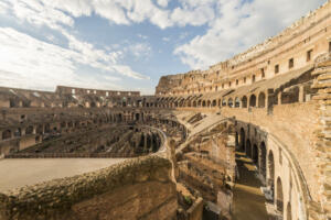 View of the famous Colosseum in the city of Rome, at sunset.