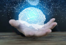 Sedem znanstvenih zgodb, ki vračajo upanje v leto 2025 Abstract palm hands holding brain with network connections, innovative technology in science and communication concept