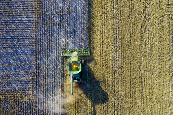 Aerial shot of green milling tractor