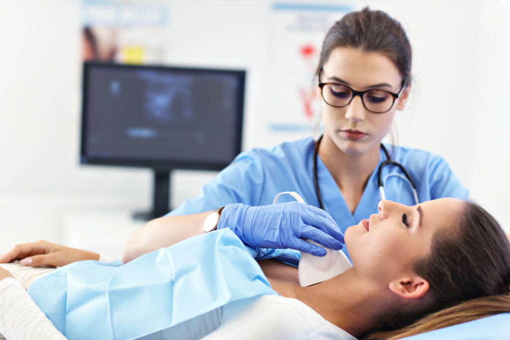 Picture of adult woman having a visit at female doctor's office