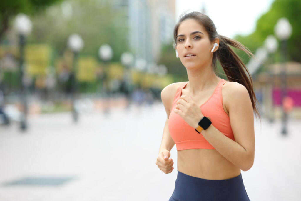 Runner running listening to music