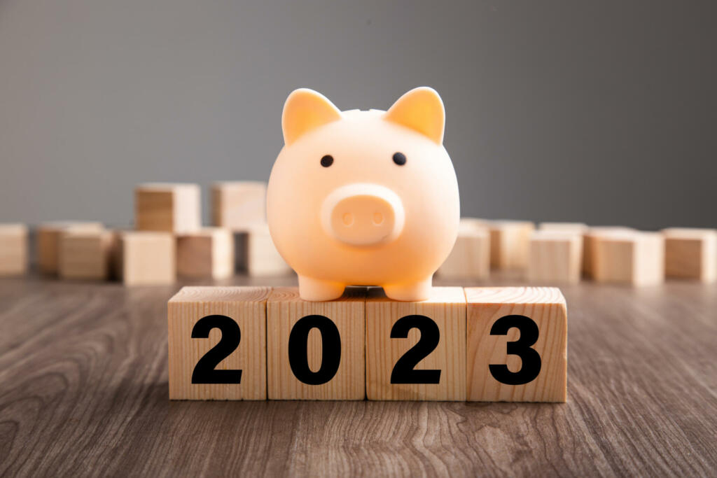 Budget Plan 2023. Piggy Bank on top of wooden block