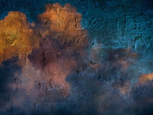 Engraved writings on colorful stone wall. 3D rendering