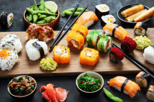 Japanese food assortment on dark background. Traditional food concept. Dishes and appetizers of indeed cuisine.
