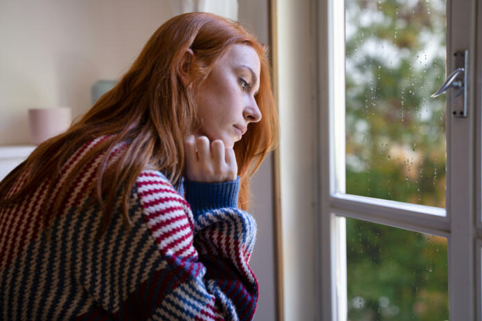 Lonely young woman feeling alone and negative emotion