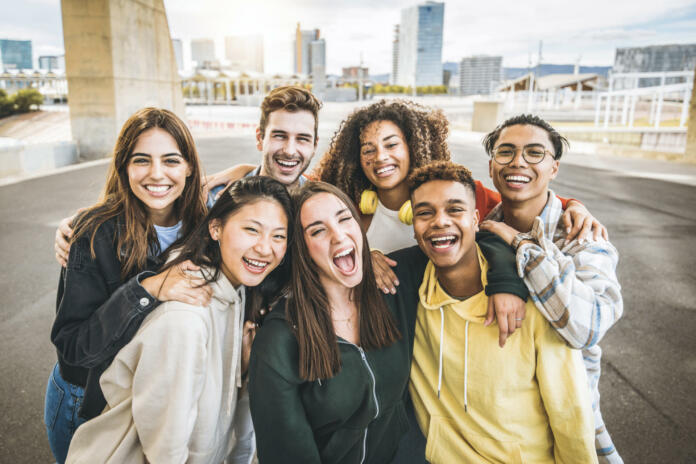 multiracial-group-of-friends-taking-selfie-picture-outdoors-millennial-people-having-fun-on-city-street-international-students-smiling-together-at-camera-youth-culture-and-community-concept-stockpack-istock Multiracial group of friends taking selfie picture outdoors - Millennial people having fun on city street - International students smiling together at camera - Youth culture and community concept