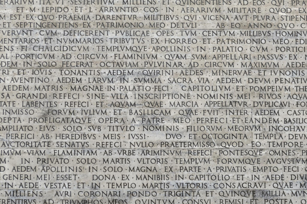 Texture of latin words engraved on a marble plaque