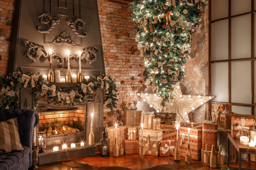 alternative tree upside down on the ceiling. Winter home decor. Christmas tree in loft interior against brick wall. Old vintage furniture.