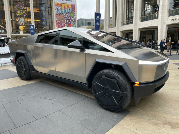 Cybertruck by Tesla is put out in public at Lincoln Center in New York along with other Tesla vehicles.