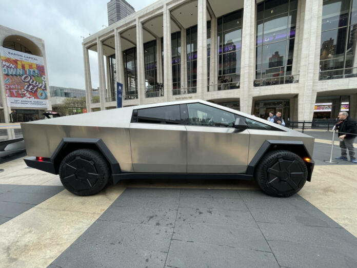 Cybertruck by Tesla is put out in public at Lincoln Center in New York along with other Tesla vehicles.