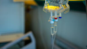 Intravenous treatment bags in a hospital discharge their vital contents