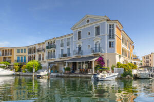 Luxury waterfront homes with boat docks on Venetian style canals in the residential planned community of Port Grimaud, near the village of Grimaud and close to Saint-Tropez along the French Riviera, Cote d'Azur.