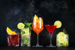 Most popular trendy cocktails set: Spritz, negroni, mojito, gin tonic and cosmopolitan on gray bar counter background