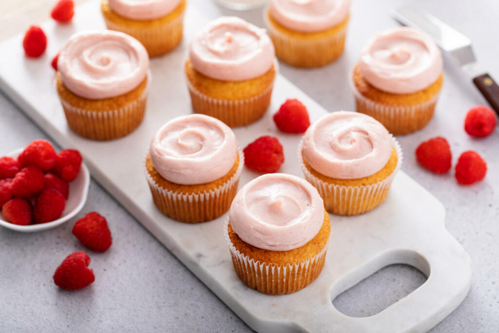 Raspberry cupcakes with a swirl of cream cheese raspberry frosting