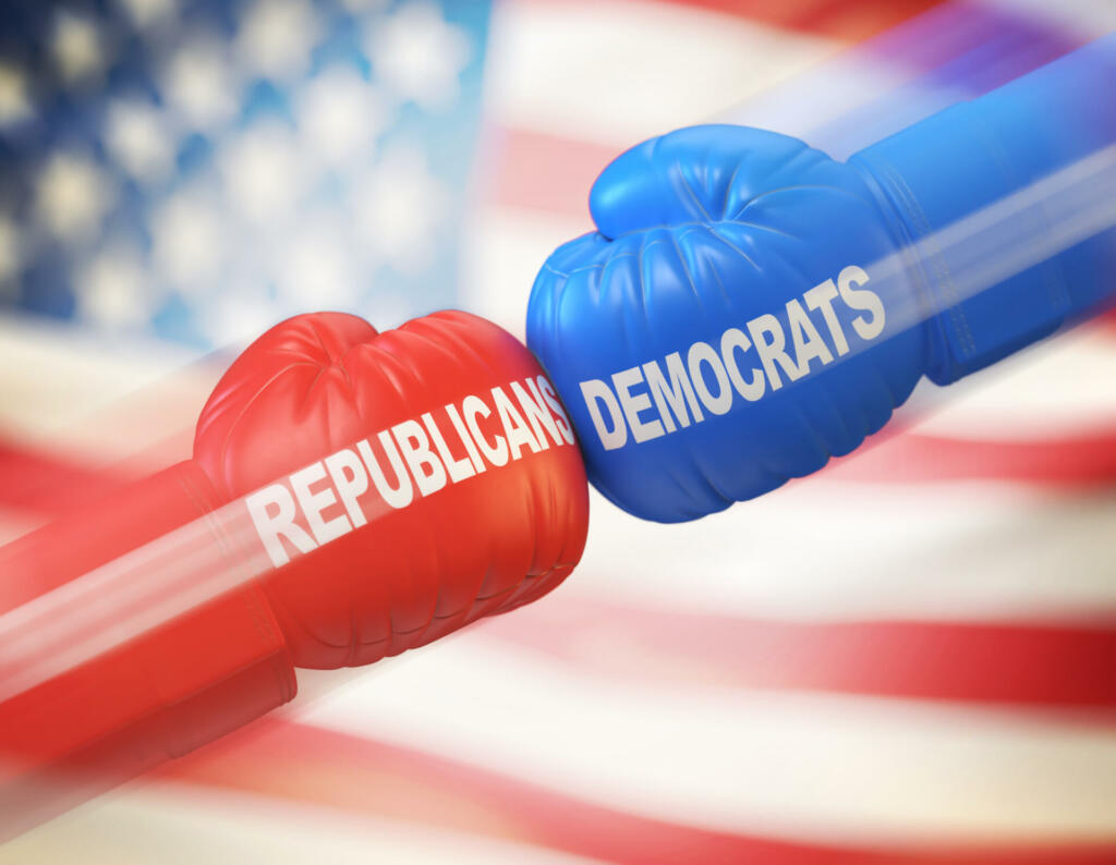 Democrats vs. Republicans. Two boxing gloves against each other in colors of Democratic and Republican party, 3d rendering
