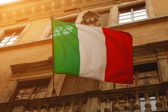 Italian flag on the streets of the old town. Bottom view